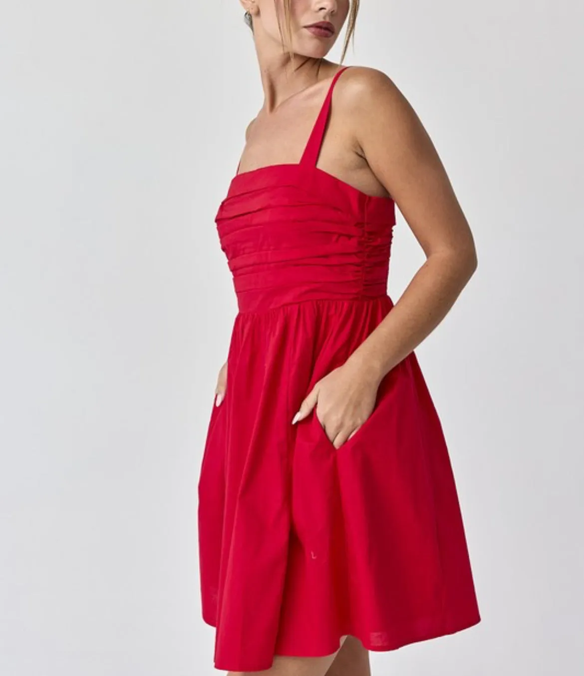 Red ruched empire waist mini dress with spaghetti straps